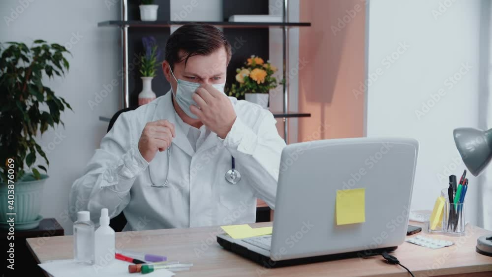 Portrait of a doctor putting on a protective mask.Health concept Portrait of a doctor putting on a protective mask.Health concept