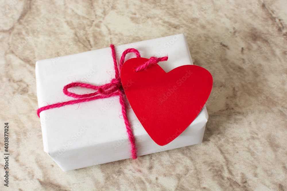 Fototapeta premium Gift box with heart-shaped card.