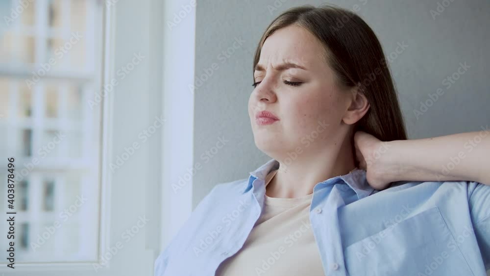 Office worker feeling neck pain, tension headache, lack of physical activity Office worker feeling neck pain, tension headache, lack of physical activity