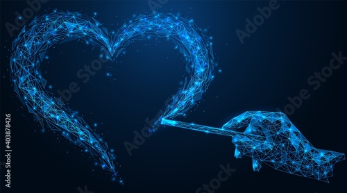 A hand with a magic wand draws a heart shape in the air. Witchcraft for love. Polygonal construction of concatenated lines and points. Blue background.