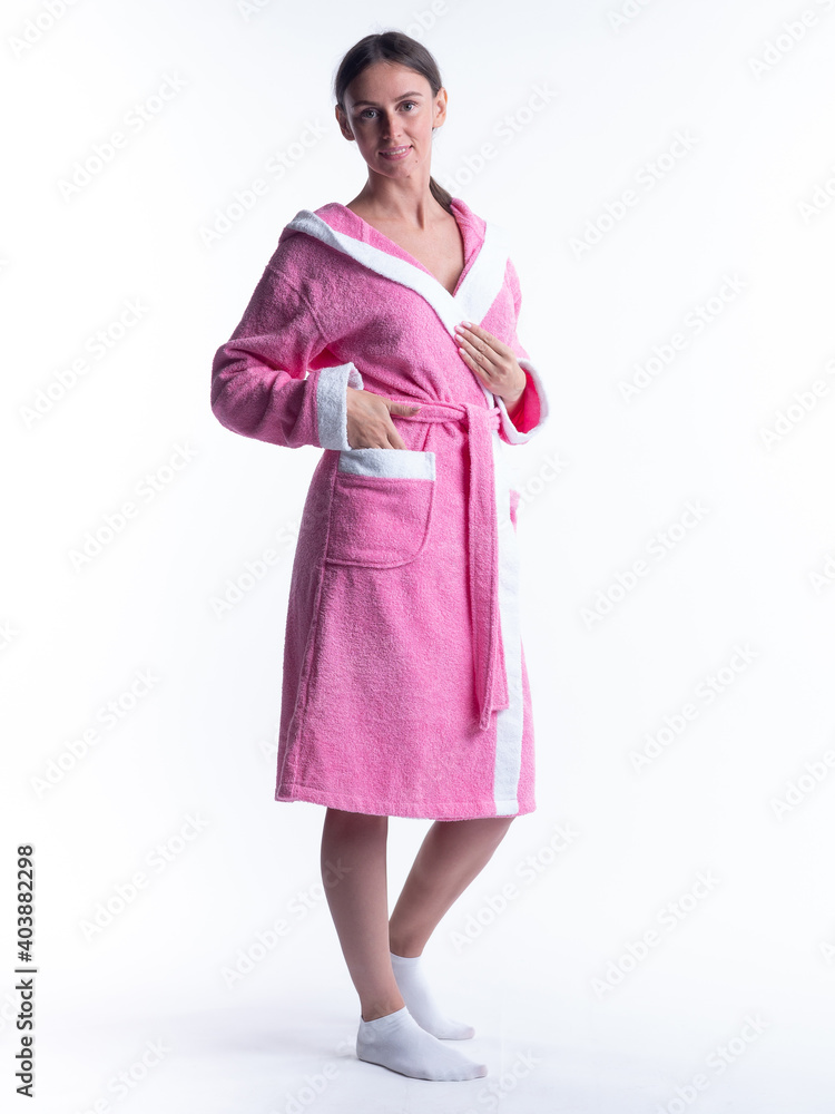 woman in a Bathrobe on an isolated white background with a smile on her face. woman in a Bathrobe on an isolated white background with a smile on her face.