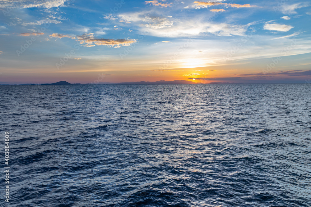 beautiful horizon on the ocean with dramatic clouds in the sky at sunset beautiful horizon on the ocean with dramatic clouds in the sky at sunset
