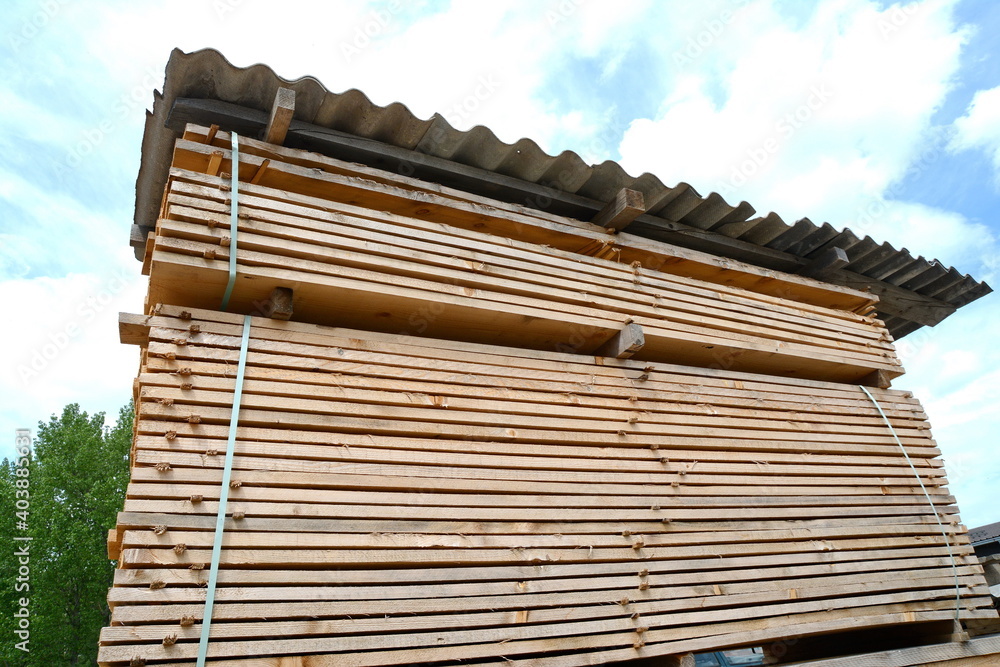 large stacks of wooden planks at the building material depot. large stacks of wooden planks at the building material depot.