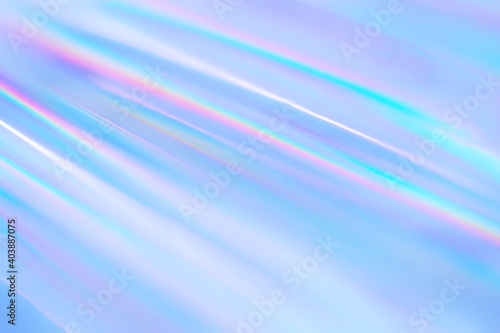 cool abstract blue holographic background of diagonal stripes in places with blur