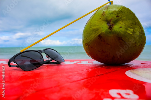 Sunglasses and coconut water in Porto Seguro beach