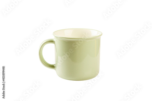 Light green enamel mug isolated on white background.
 photo
