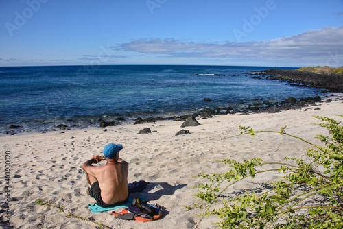 Tourist in the bay of Isla San Cristobal, Galapagos Islands, Ecuador