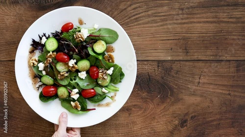 Wallpaper Mural Serving a Healthy Salad with Cucumbers, Tomatoes, Goat Cheese and Walnuts Torontodigital.ca