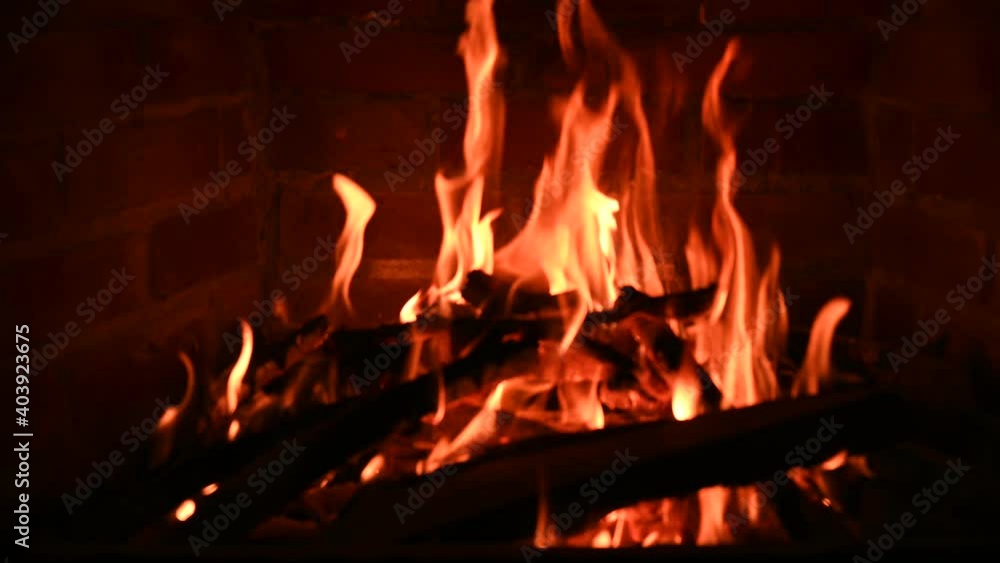 Close up view of a fire burning inside a fireplace Close up view of a fire burning inside a fireplace