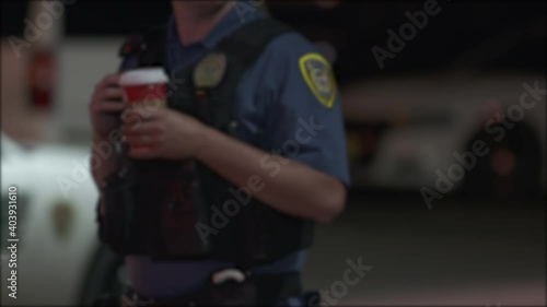 Police Officer with Coffee Blurry 4K photo