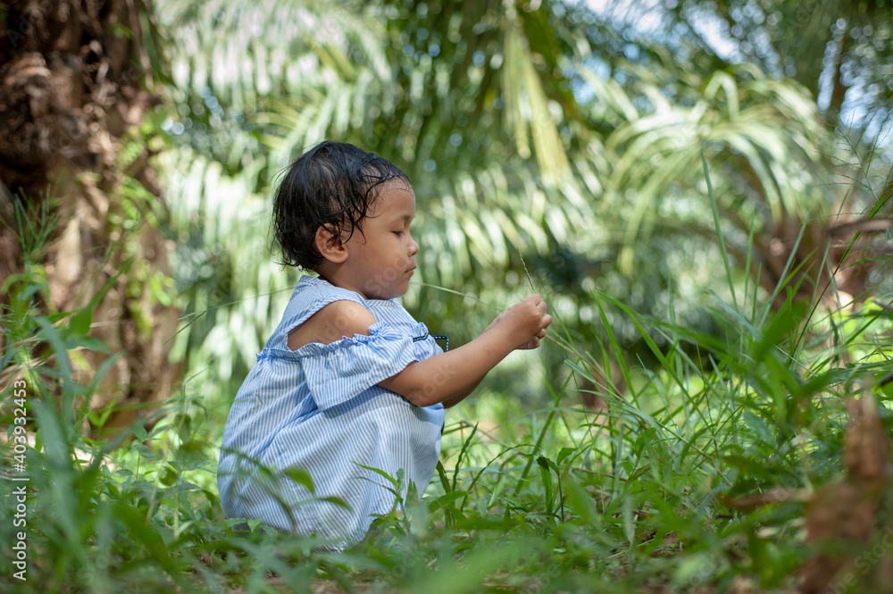 Happy cute Asian girl enjoy playing outdoor in summer. Happy cute Asian girl enjoy playing outdoor in summer.