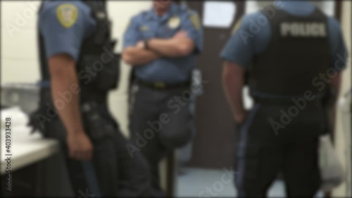 Police Officers on Break in Office Blurry 4K