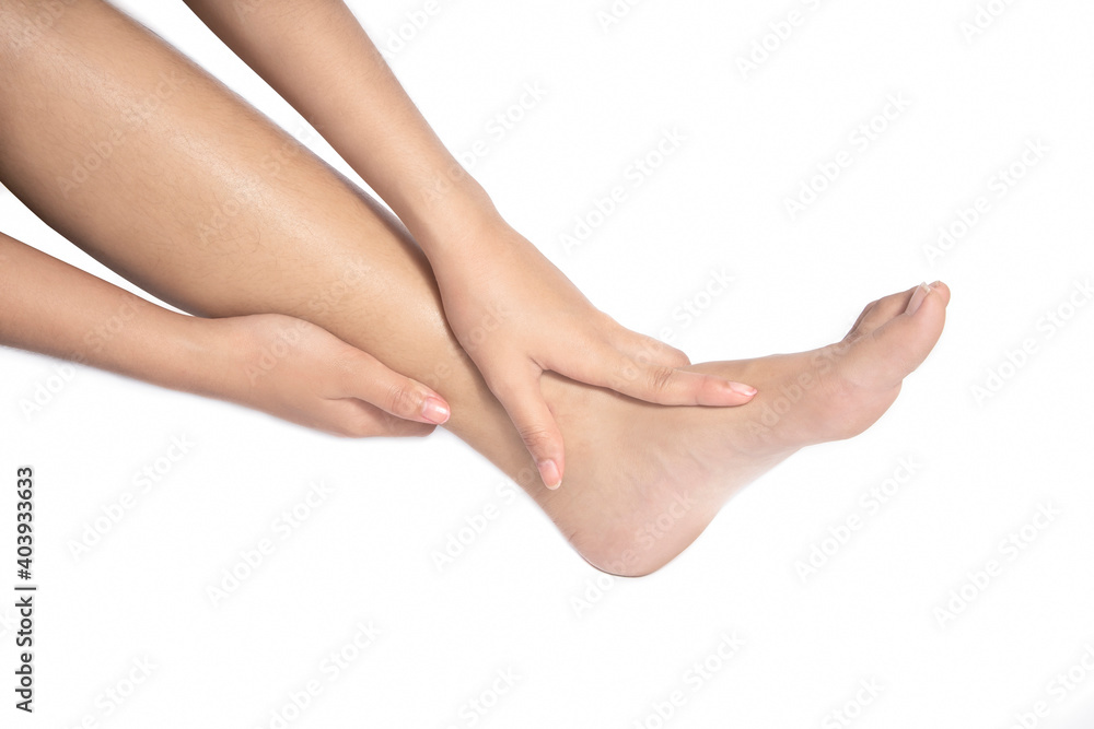 Women she is taking care of her feet. Isolated white background