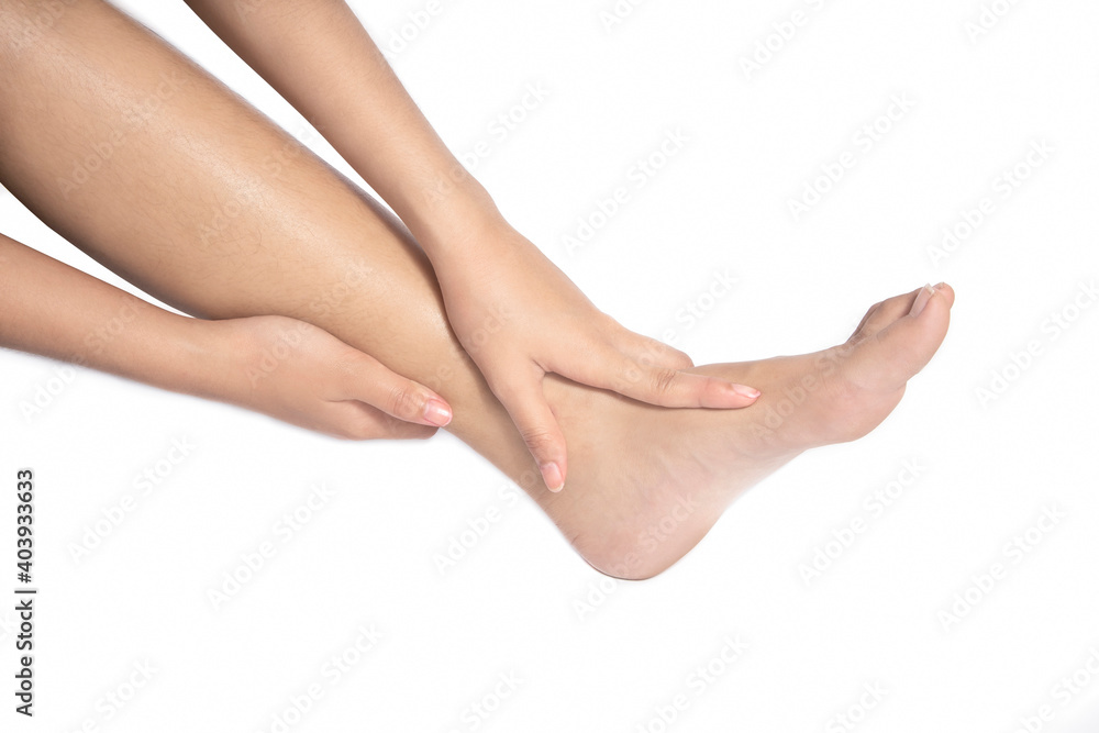 Women she is taking care of her feet. Isolated white background Women she is taking care of her feet. Isolated white background
