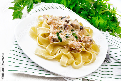Pasta with salmon in cream on board