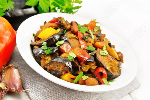 Ragout with eggplant and pepper on light board