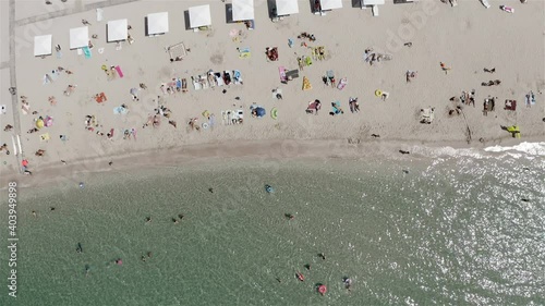 tourists swim in the sea and sunbathe on the beach.