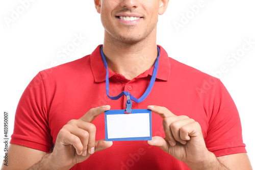 Young man with blank badge ...