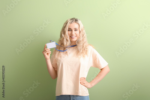 Young woman with blank badg...