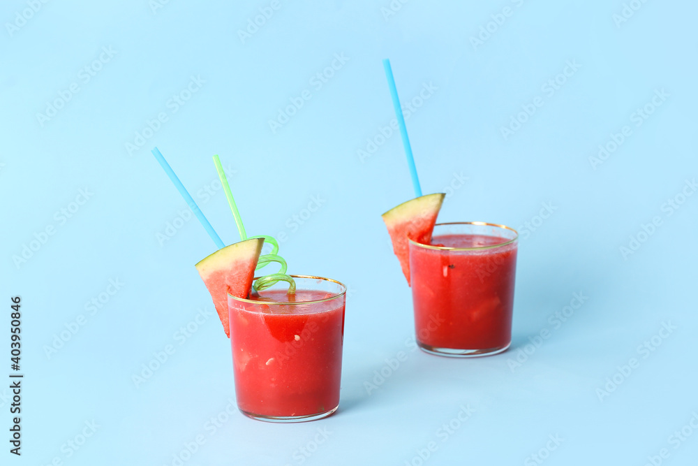 Glasses of fresh watermelon juice on color background Glasses of fresh watermelon juice on color background