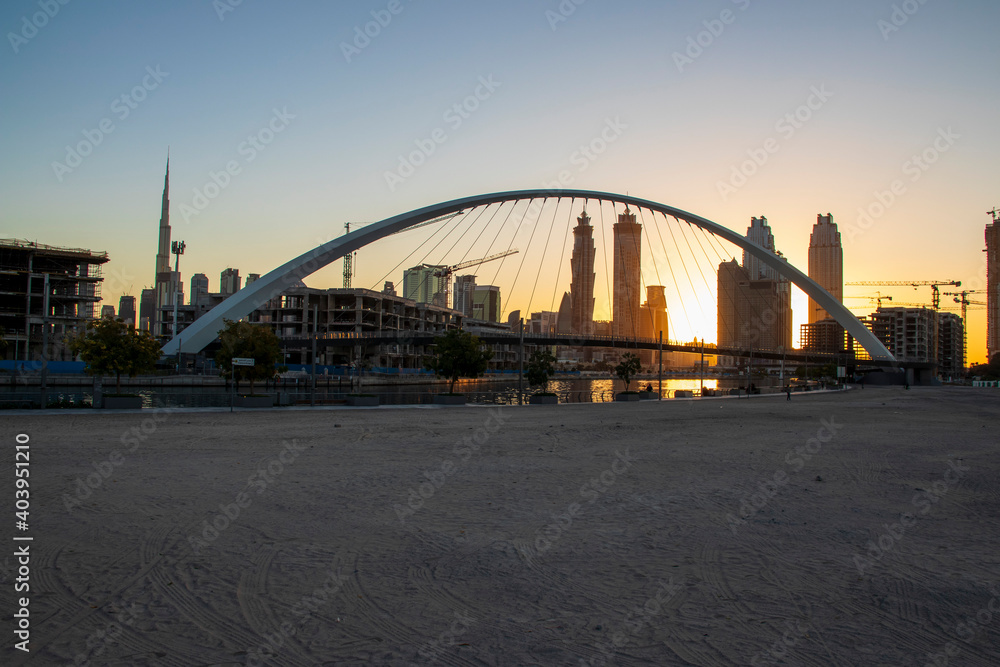 Fototapeta premium Dubai, UAE - 01.08.2021 Bridge over a Dubai Water canal known as Tolerance bridge. Outdoors