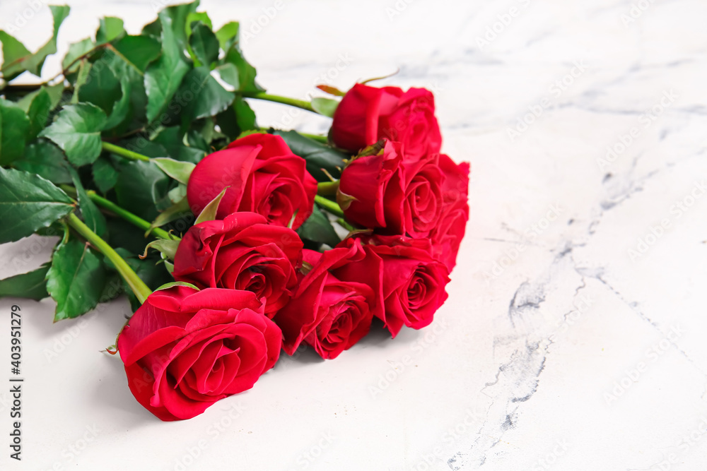 Bouquet of beautiful red roses on light background