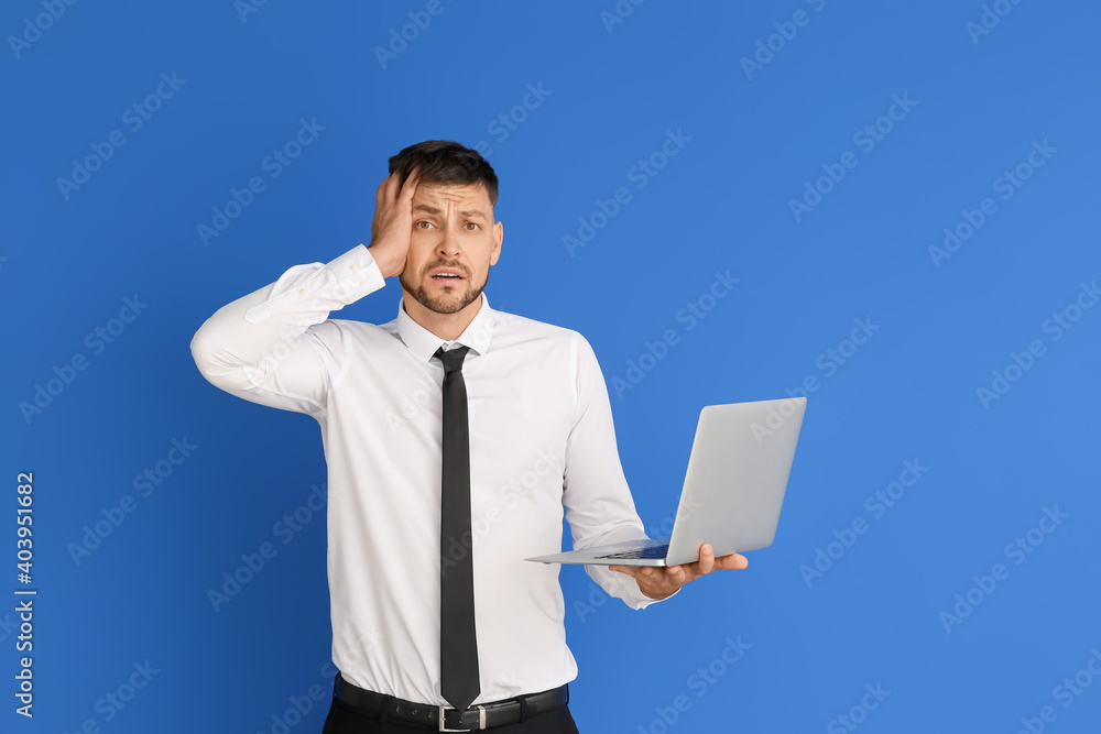 Stressed businessman with laptop on color background. Concept of deadline Stressed businessman with laptop on color background. Concept of deadline