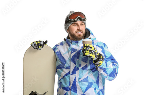 Male snowboarder with coffe...