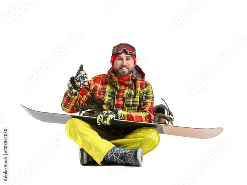 Male snowboarder showing th...