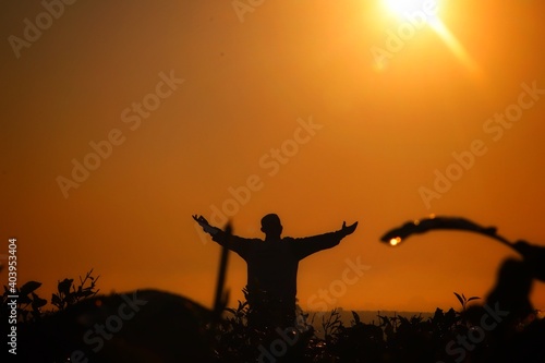 silhouette of a person in the sunset © Jagadish