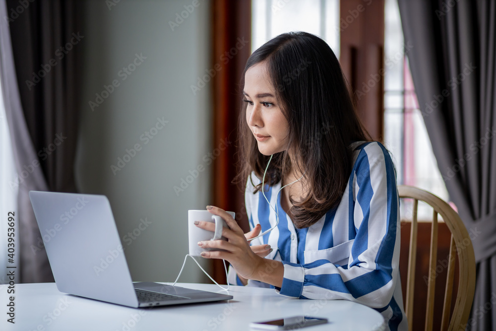 Asian woman made meeting online by using laptop. Asian woman made meeting online by using laptop.