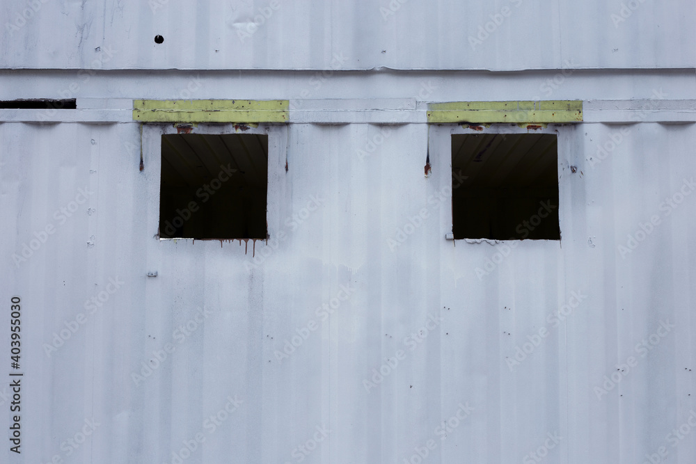 Old wall made of white cargo ship container Old wall made of white cargo ship container