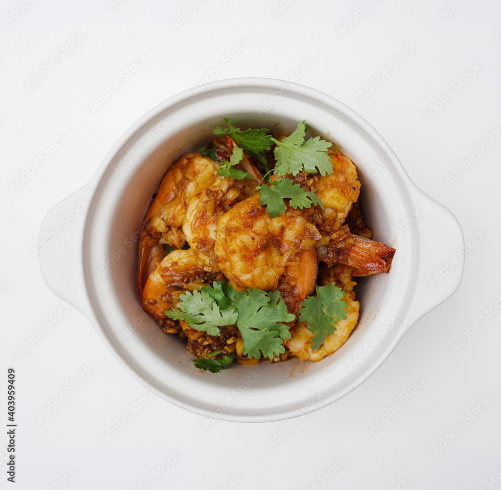Deep fried shrimps with garlic and coriander in a bowl isolated, Top down view of Thai food on a white background Deep fried shrimps with garlic and coriander in a bowl isolated, Top down view of Thai food on a white background