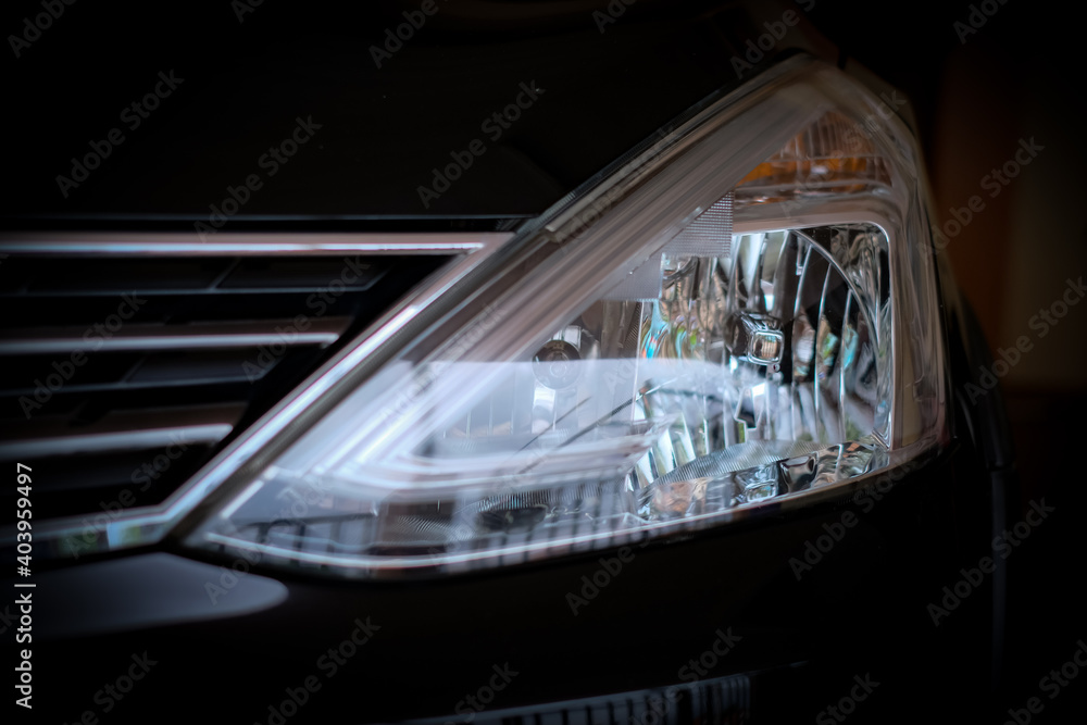 Close up headlamp or light reflection on black background 