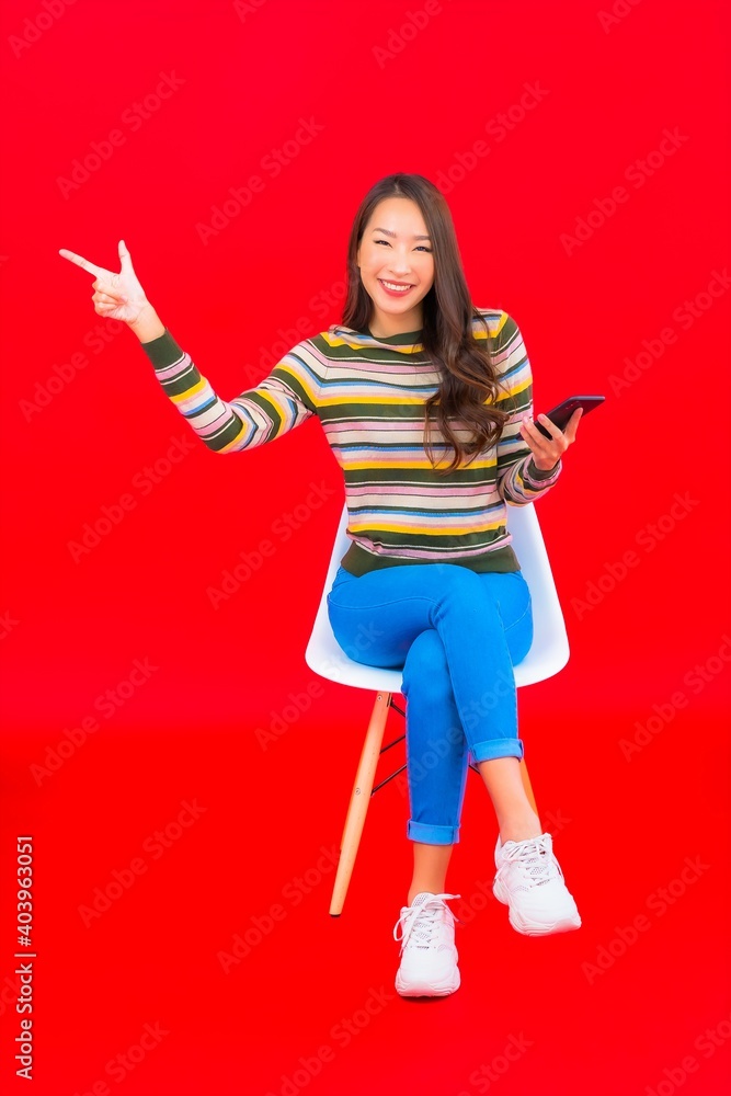 Portrait beautiful young asian woman with coffee cup and smart mobile phone Portrait beautiful young asian woman with coffee cup and smart mobile phone