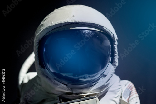 Fototapeta Spacesuit helmet visor close up on astronaut