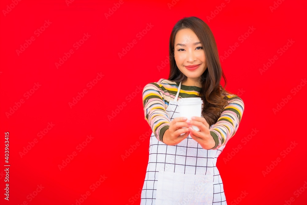 Portrait beautiful young asian woman wear apron with coffee cup Portrait beautiful young asian woman wear apron with coffee cup