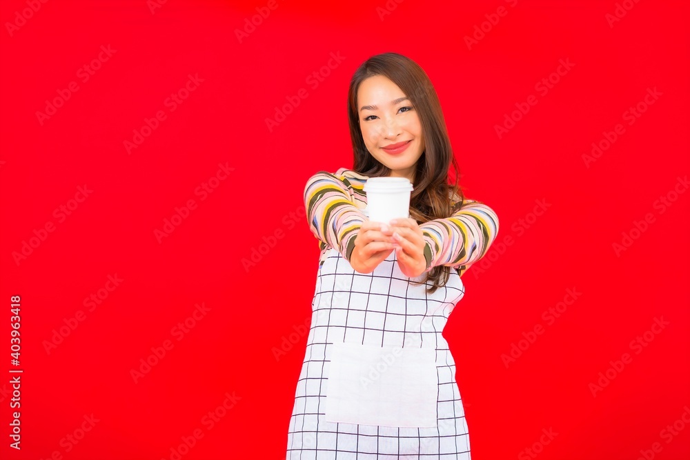 Portrait beautiful young asian woman wear apron with coffee cup Portrait beautiful young asian woman wear apron with coffee cup