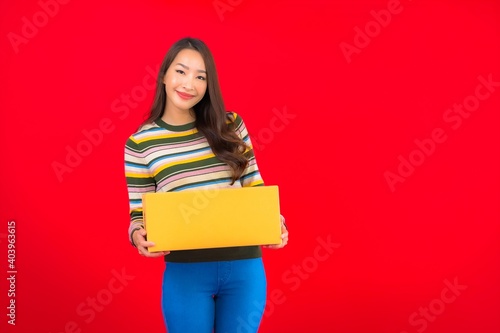Portrait beautiful young asian woman with parcel box