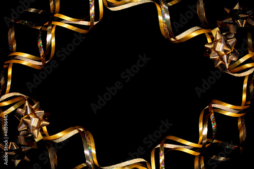 beautiful festive background, golden serpentine on a black background