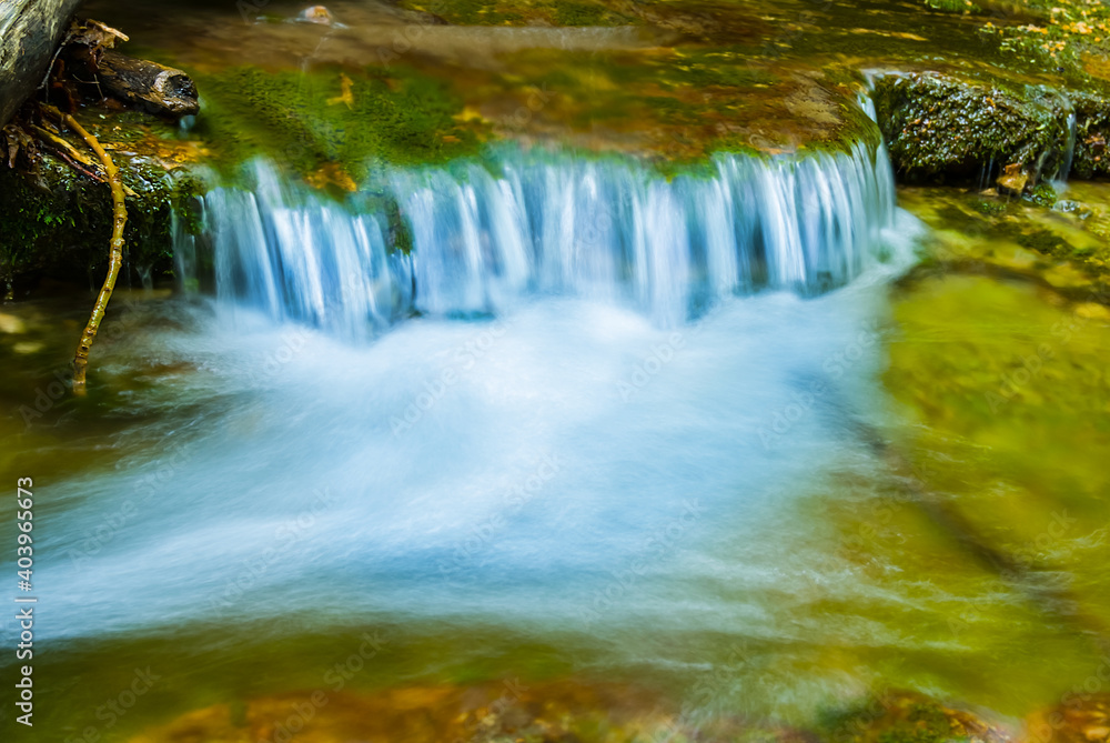 closeup waterfall on the mountain river, beautiful natural background closeup waterfall on the mountain river, beautiful natural background