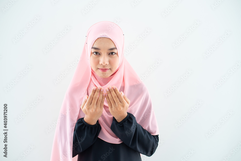 Half length front view of asian young beautiful muslim woman prayer dress hijab pray meditation in mosque for eid mubarak life and soul fasting of international islamic ramadan Namaz. Half length front view of asian young beautiful muslim woman prayer dress hijab pray meditation in mosque for eid mubarak life and soul fasting of international islamic ramadan Namaz.