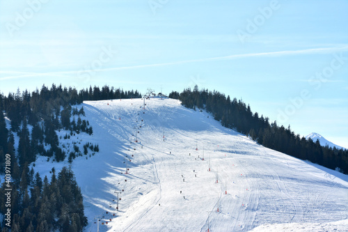 Shot of amazing landscapes and a skiing field of the Rodna mountains on a cold winter day photo