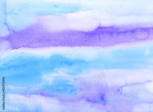 Watercolor light blue and purple background painting texture. Colorful pastel soft backdrop. Stains on paper.