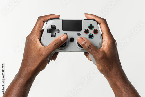 Hands holding video game controller