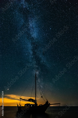 Classic dutch boat with milky way in the background photo