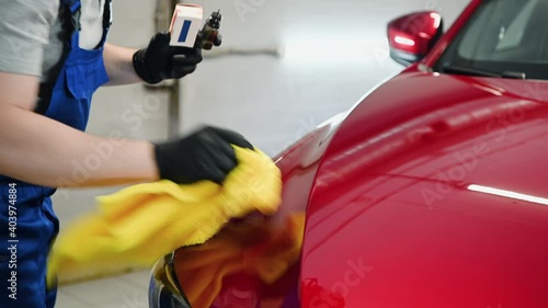 Manual car wash, a man washes the car from a special hose. Manual portable car wash. Detailed and gentle car care. High quality 4k footage.