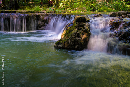 Fototapeta Naklejka Na Ścianę i Meble -  Beautiful waterfall in tropical rainforest green tree background