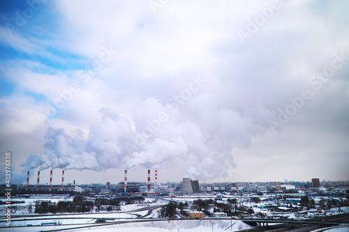 Factory in the city. Cityscape. Environmental problem of environmental pollution and air in large cities