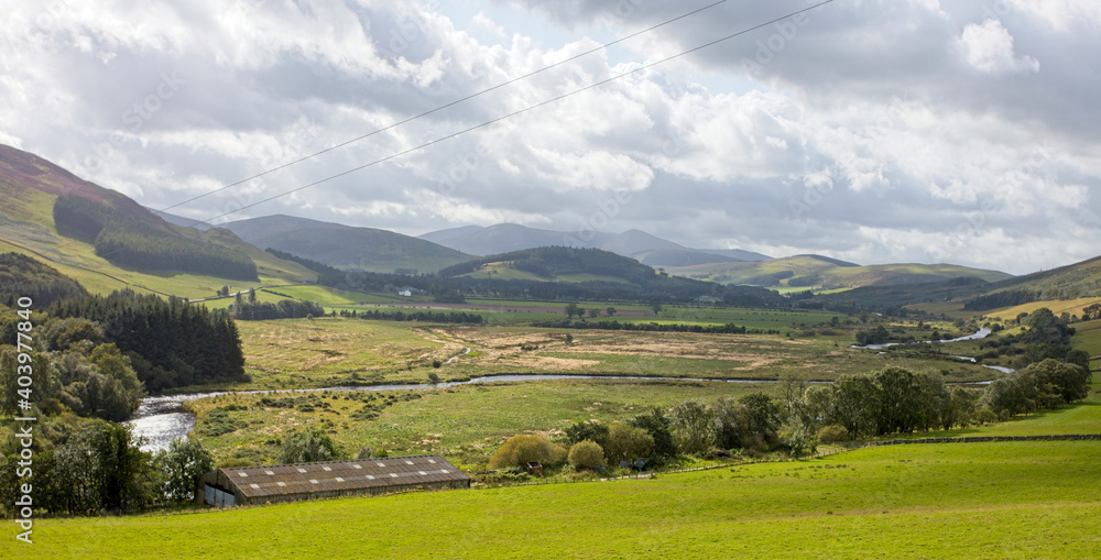 Farmland in a broad valley of the Southern Uplands, Scottish Borders, Scotland, UK.